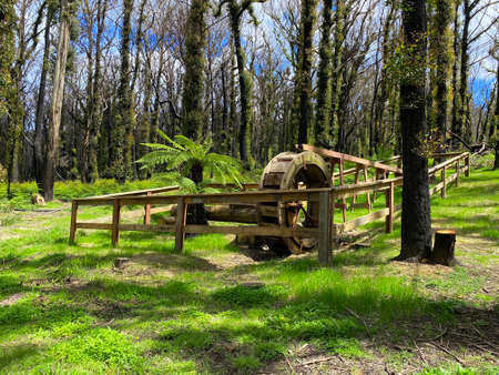 An old wooden water wheel after a bushfireの写真素材