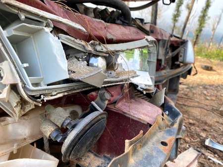 An abandoned, damaged carの写真素材