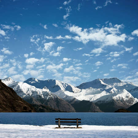 A Mountain Landscape with Lake and Benchの写真素材