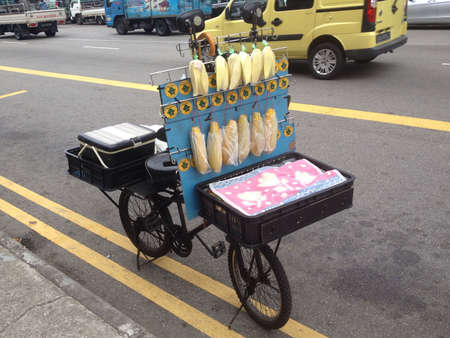 Traditional rare street food bicycle found in metropolitan Singapore - bicycle selling sweet corn along roads of Geylangの素材