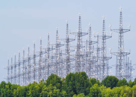 Many steel frame wind turbines Located in the mangrove forest area by the sea To use to produce...
