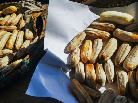 Dried bananas on bamboo basket weaving Secondary. Rural food preservation methods. Preserved for a long time Dried bananas have a sweet taste, providing energy, high vitamin food.の写真素材