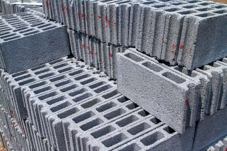 Aerated bricks pile stacked in the construction area Prepare for the plasterer to build cement plaster walls. Lightweight bricks. Brick that water can penetrate.の写真素材