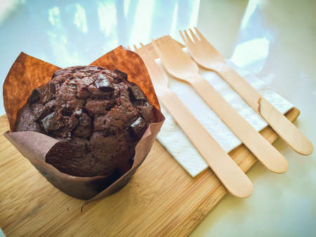 Chocolate Cup Cake Mix chocolate pieces, on a wooden chopping board and utensils made from natural wood. Break food that is commonly used in conference breaks.の写真素材