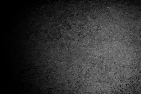 Background image of a black and white plaster wall surface. Distinctive product background. Images that are strong, seductive, attractive.の写真素材