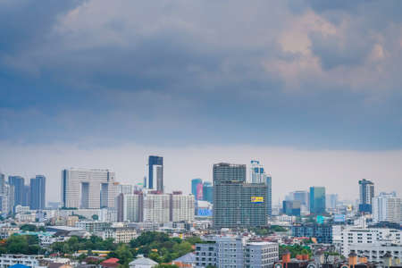 25 April 2020, sky conditions and buildings before heavy rain, gray sky overcast. The atmosphere before the rain in Bangkok, Thailand.のeditorial素材