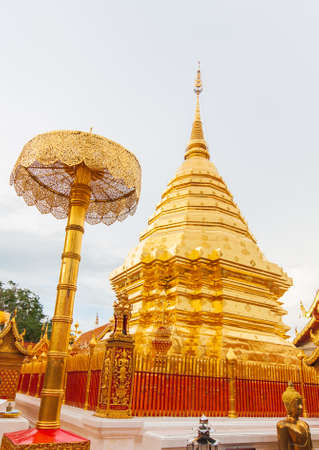 Golden pagoda at Doi Suthep pagoda on a day when the forest smoky sky covered the temple grounds. Beautiful public tourist spots in Chiang Mai, Thailand.の写真素材
