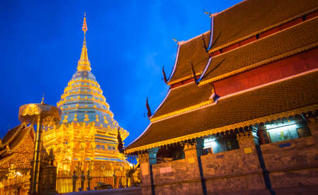 The golden pagoda of Doi Suthep, a beautiful glow at night. Beautiful public tourist spots in Chiang Mai, Thailand.の写真素材