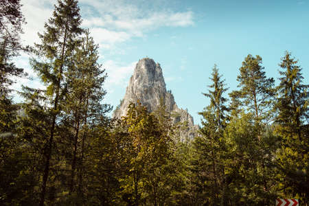 Christian cross on mountain peak in Romaniaの写真素材