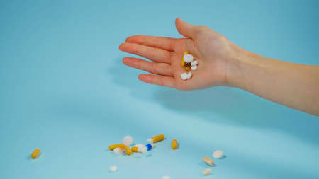 Giving up Treatment with Medicine Concept. Hand Throwing pills.の写真素材