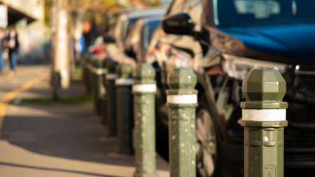 Row of plastic pillars between road street and pedestrian sidewalks.の写真素材