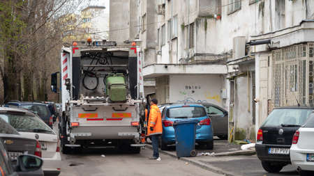 BUCHAREST, ROMANIA - May 15, 2021: White Garbage truck used for Collection of waste or garbage in Bucuresti. Garbage solid household waste collectionのeditorial素材