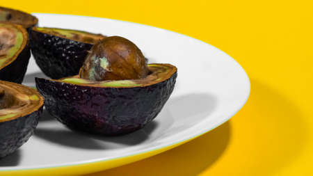 Copy Space Yellow Background Bad Avocado Plate.の写真素材