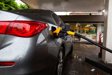 Car refueling fuel on petrol station. Service is filling gas or biodiesel into the tank. Automotive...