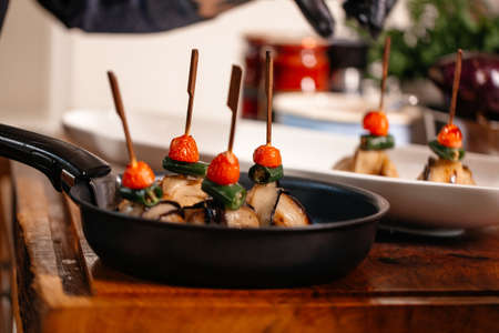 Fried Eggplant with Peppers, tomatoes and Appetizing Fried Beef Meatballs. Food Art.の写真素材