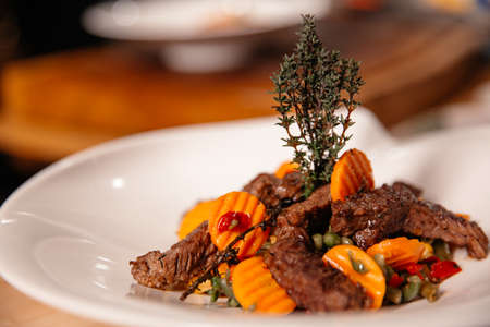 Beef Meal Presentation on White Plate Close Up. Chef Specialty Dish.の写真素材
