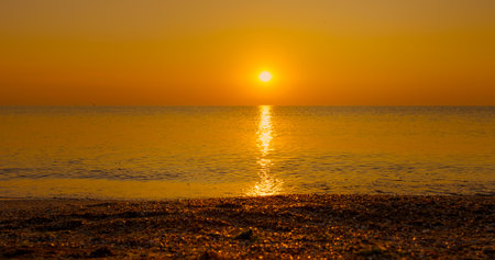 Risen on the beach watch shining golden waves close up. Beautiful landscape, travel destinations, enjoying holiday, seaside.の写真素材