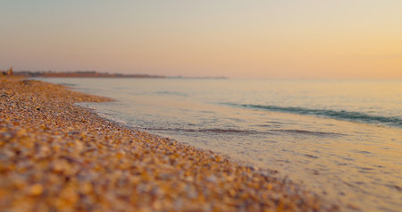 Sea, vacation seaside. Bright golden waves at sunset on the beach the black sea.の写真素材