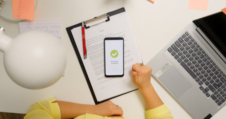 Woman working from home paying online from phone. Happy customer accepted payment online contactless.の写真素材