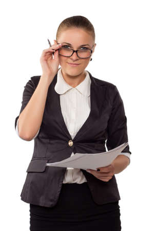 Businesswoman with glasses standing with documents isolated on whiteの写真素材