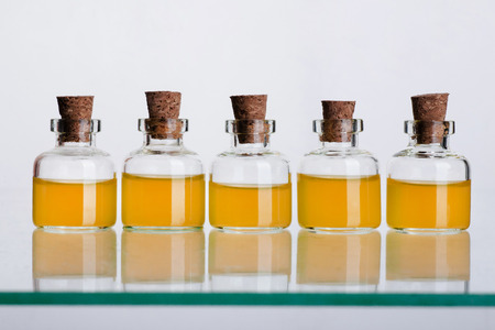 Many glass medicine bottles with color waterの写真素材