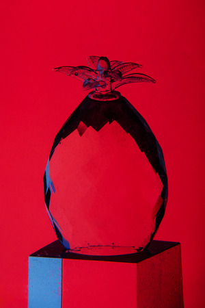 Glass pineapple on color backgroundの写真素材