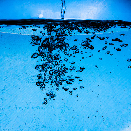 underwater air bubbles in motionの写真素材