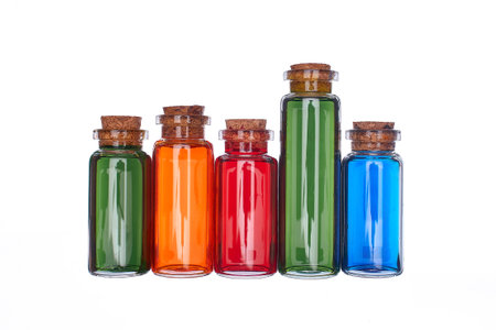 Many filled glass bottles on isolated backgroundの写真素材