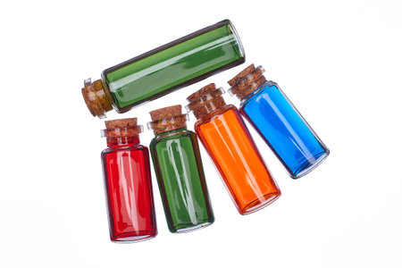 Many filled glass bottles on isolated backgroundの写真素材