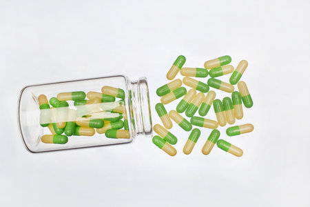 One semi-transparent bottle with  with capsulesの写真素材