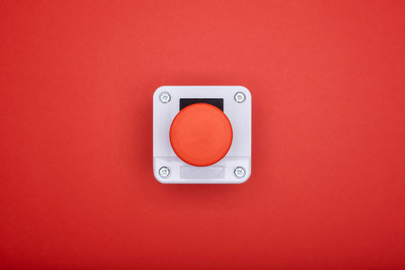 Single emergency button at the red background at the top viewの写真素材