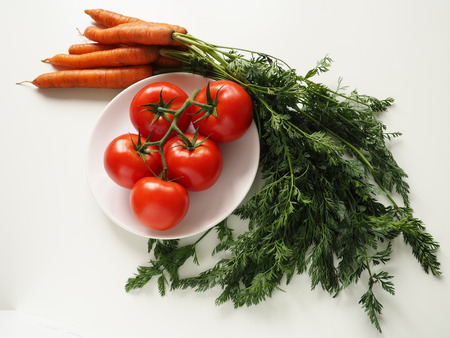 Tomatoes and carrotsの写真素材