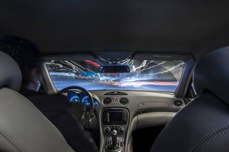 Car interior speed driving in blurry long exposureの写真素材