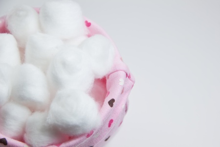 Cotton balls in pink bag top viewの写真素材