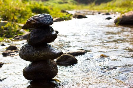 Zen in river forest, rock tower peaceの写真素材