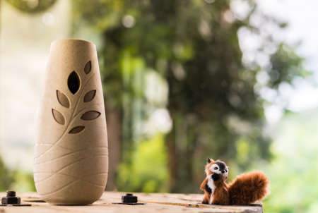 squirrel doll, ceramic vase