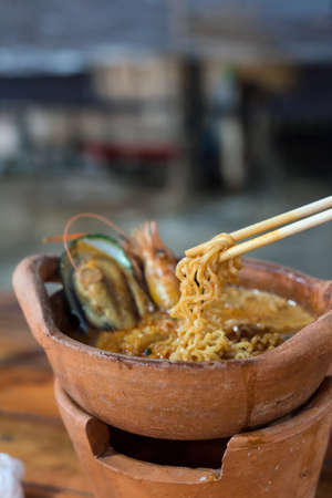 Tom Yum Goong soup, clay pot