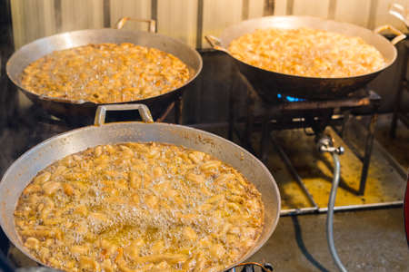 Chicken frying in a panの写真素材