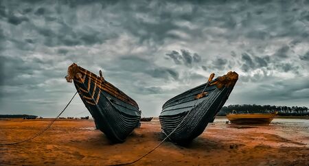 Indian boat resting in sea sideの写真素材