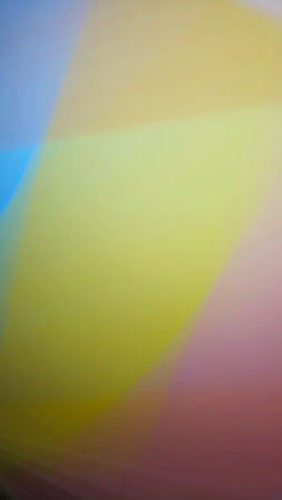 Smooth and blurry colorful gradient mesh background. Purple, yellow, green and black.