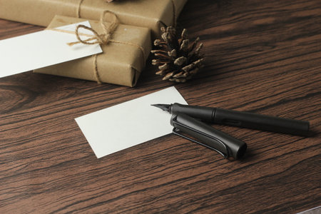 A birthday gift box wrapped in recycled paper is being prepared on the table.