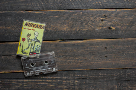 Bangkok, Thailand - January ,22 2022 : 90's cassette tapes of Nirvana Album Incesticide on a black wooden floor.のeditorial素材
