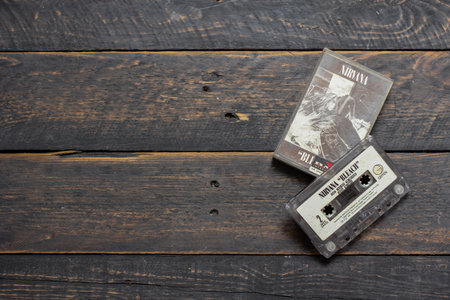 Bangkok, Thailand - January ,22 2022 : 90's cassette tapes of Nirvana album Bleach on a black wooden floor.のeditorial素材