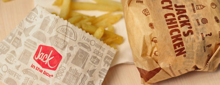 WASHINGTON, USA - January 10, 2023 : A home-style rance chiken club burger or Jack Spicy Chicken Burger served on a wooden table in a jack in the box restaurant in the USA.のeditorial素材