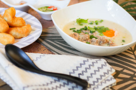 Chinese style porridge or porridge and fried dough stick or fried dough stick or donut or fried...