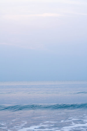 Bubbles on golden beach with ocean water in the morning at Thailand beaches.