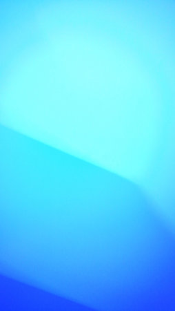 abstract blue background with some smooth lines in it and some reflectionsの写真素材