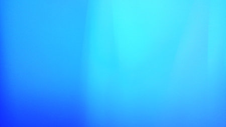 abstract blue background with some smooth lines in it and some reflectionsの写真素材