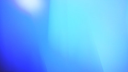 abstract blue background with some smooth lines in it and some reflectionsの写真素材