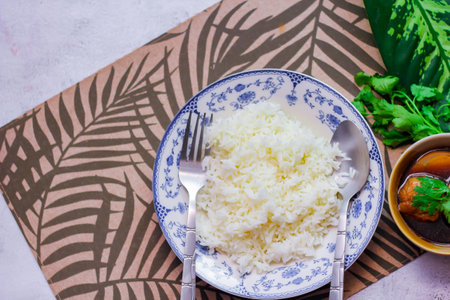 Steamed rice in an ancient plate and Stewed Eggs, Thai food and street food that are common in Thailand.の写真素材